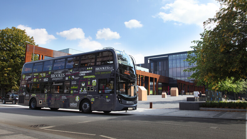 A Brookes bus traveling by the university
